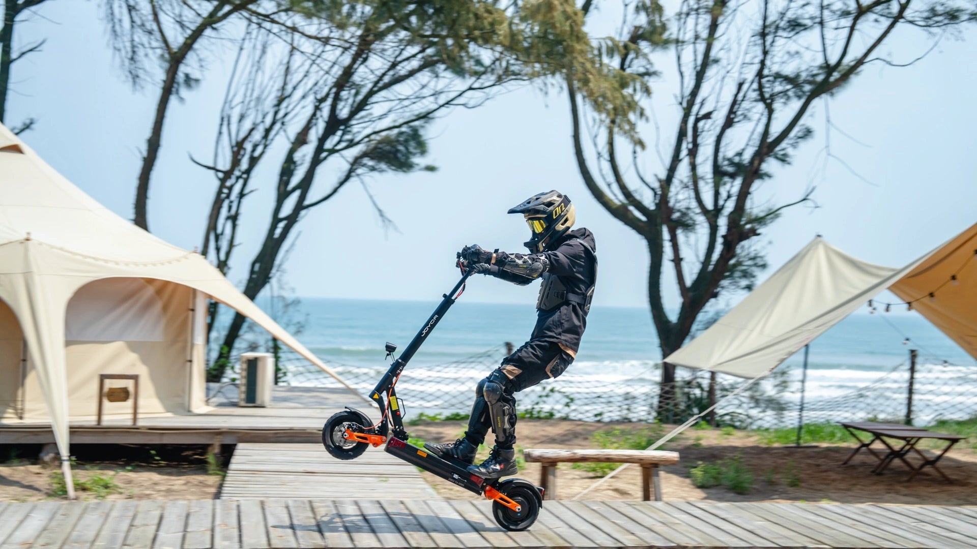 JOYOR off-road electric scooter at beach camping outdoor lifestyle banner