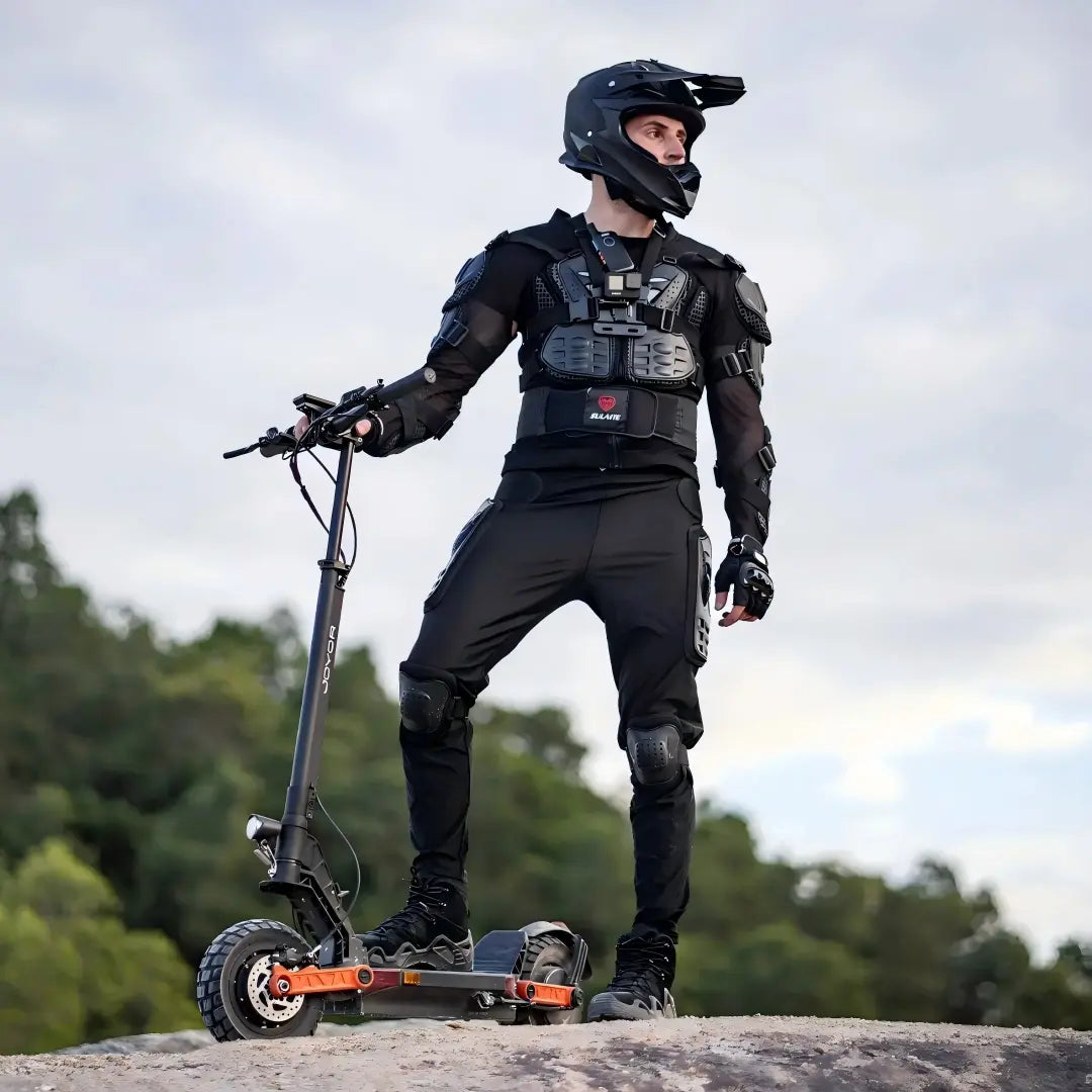 Rider using a JOYOR off-road electric scooter on an outdoor trail