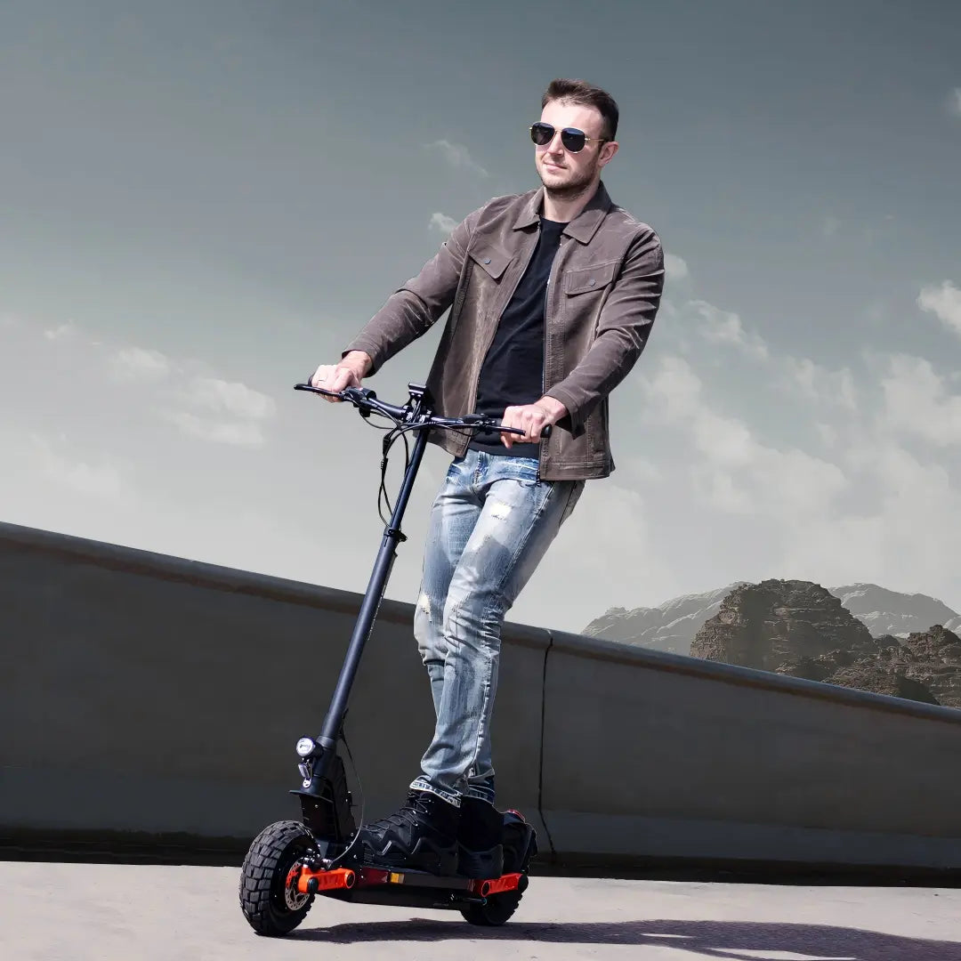 Rider using a JOYOR single motor electric scooter in an urban setting